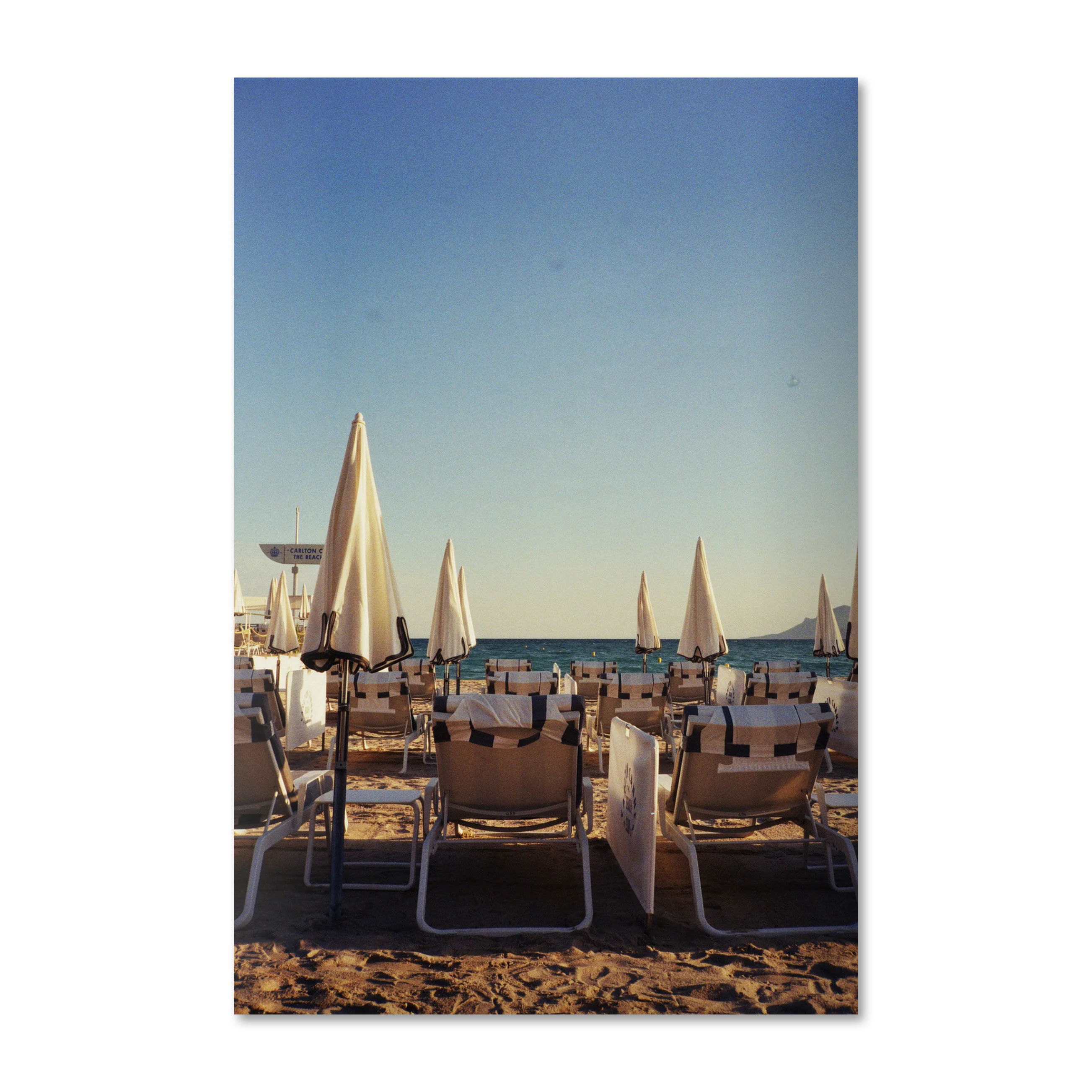 Dolce Far Niente — Mediterranean coastal wall art on frameless Alu-Dibond, Cannes loungers at golden hour