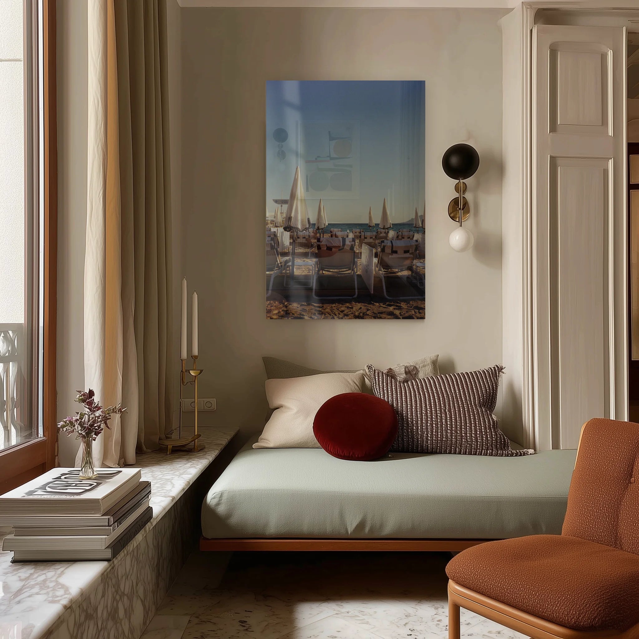 Dolce Far Niente above a low bouclé bed in a sand-toned bedroom, evening light