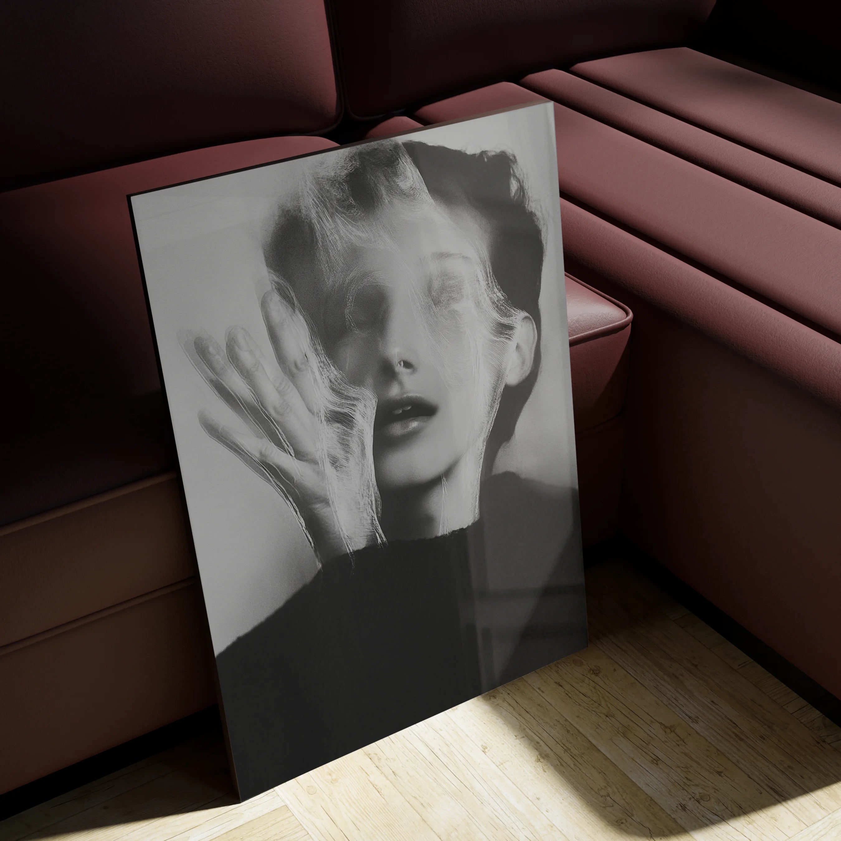 Ghosts Within 4 above a black linen sofa in a moody Berlin altbau living room