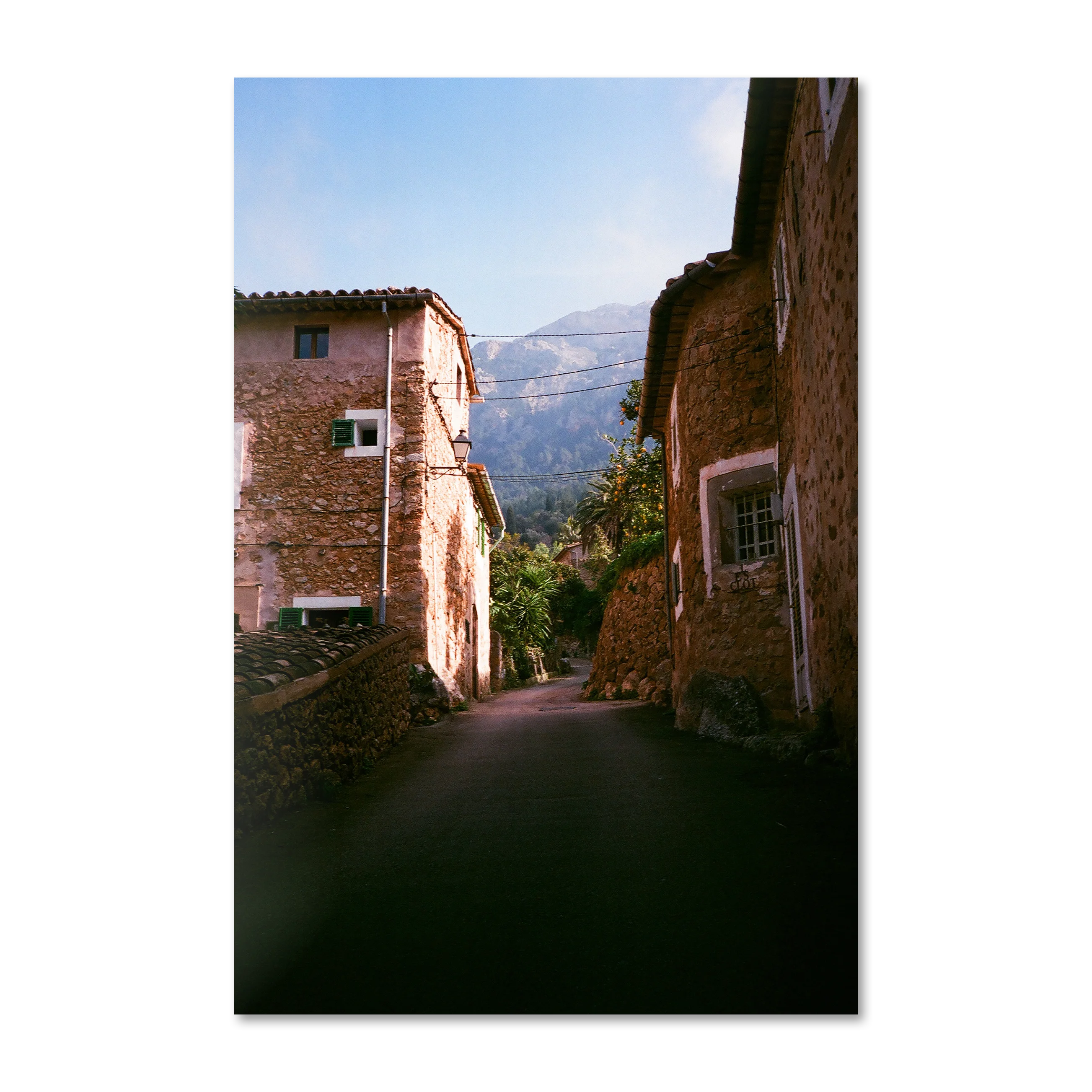 Il Vicolo by frida — sunlit Mallorcan stone alley toward the Tramuntana, on frameless Alu-Dibond