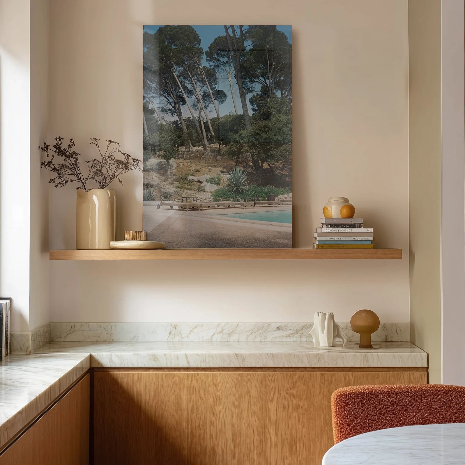 Piscina in a minimalist marble kitchen with morning light and ceramic vessels on the counter